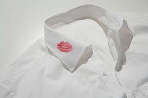 A white shirt with a red kiss on it.